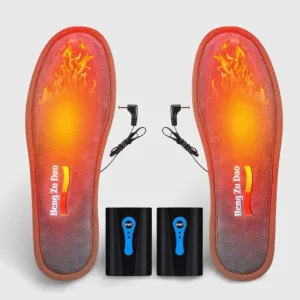 Semelle chauffante pour botte : premier plan détaillé d'une semelle noire et grise, épaisse et ergonomique, avec des fils chauffants visibles. Conçue pour un ajustement parfait dans les bottes de travail, de ski ou de randonnée. Accessoire chauffant essentiel.