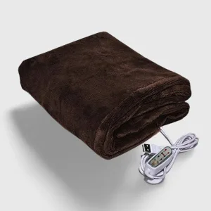 Couverture Chauffante Automne douillette et texturée, idéalement posée sur un canapé pour un confort optimal en intersaison.
